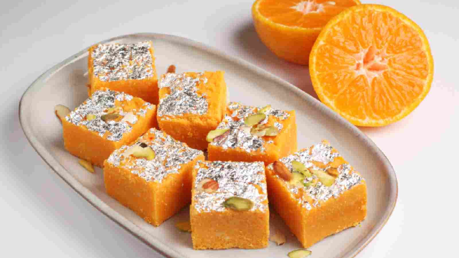 Indulge in the sweet delight of Orange Barfi delivered to your doorstep